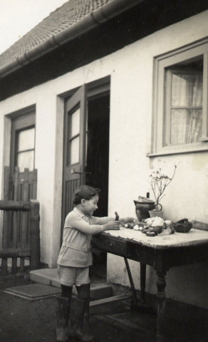 At Easter, collecting chocolate eggs and animals hidden in our garden