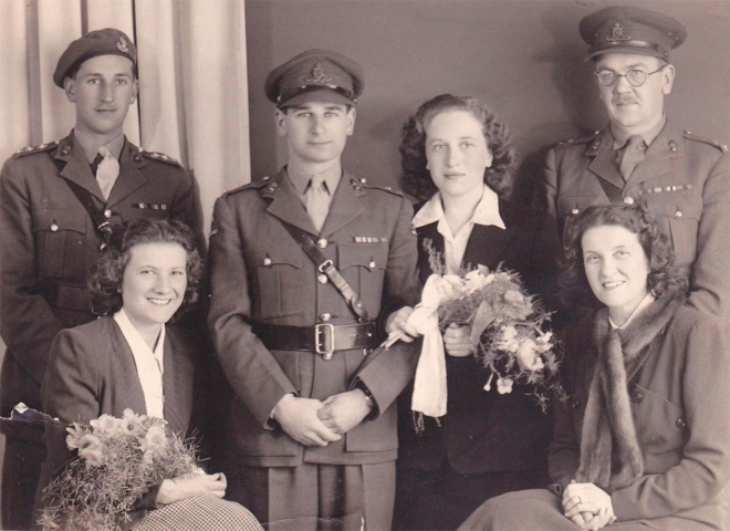 Wedding photograph with Judith's girlfriends from the Interpreters' service, Harold's colonel and his army friends