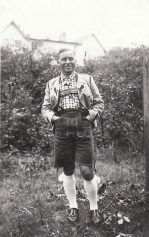 Martin Ansbacher wearing traditional Tracht country clothing - Bavarian Oak Leaf Jacket, Lederhosen, white socks with flashes (frills)